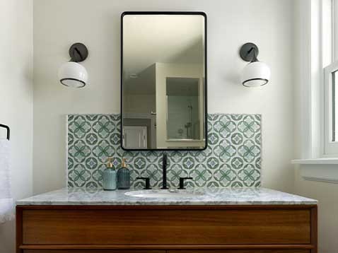 Bathroom sink and mirror with backsplash